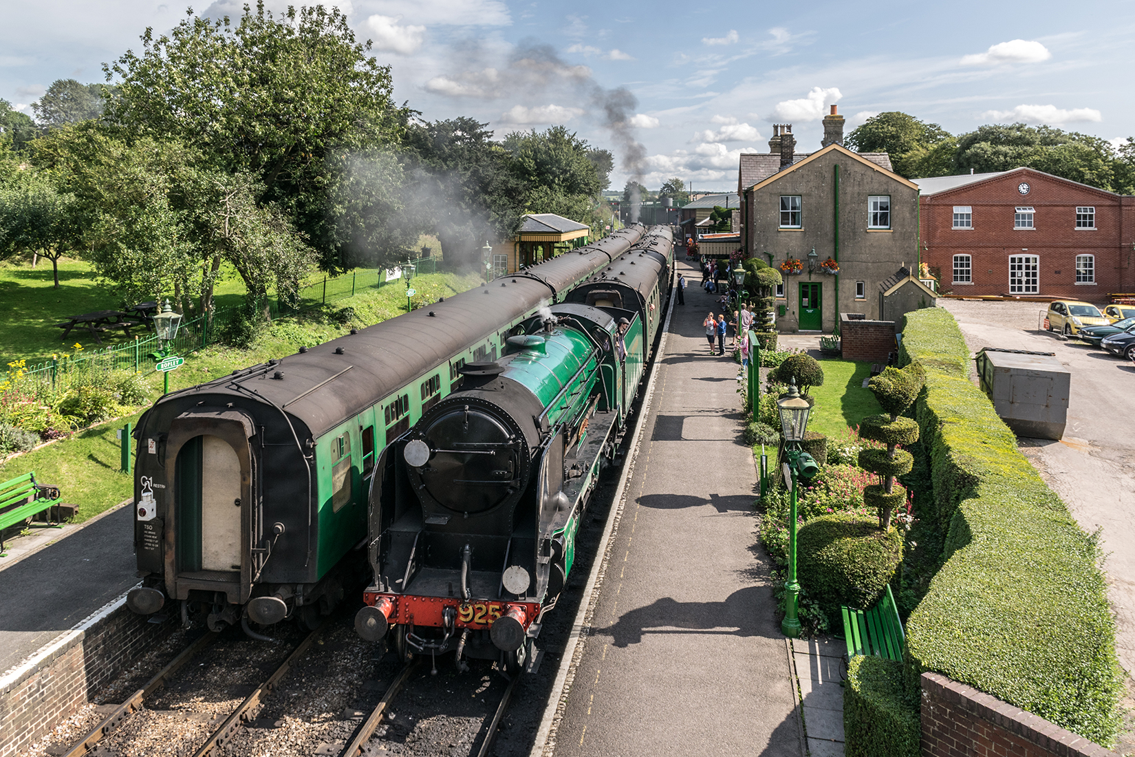 Schools' class 4-4-0, 925 'Cheltenham', pulls into Ropley station with an Alresford bound service from Alton