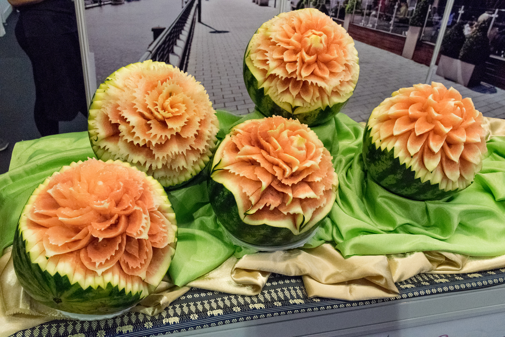 Carved watermelons against a backdrop photograph at the Blue Elephant pop-up Thai restaurant