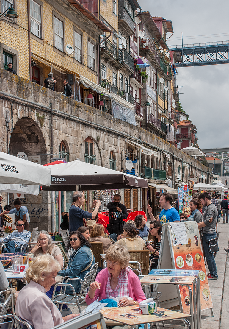 The bars and restaurants of the Praça da Ribeira waterfront shelter under medieval arches
