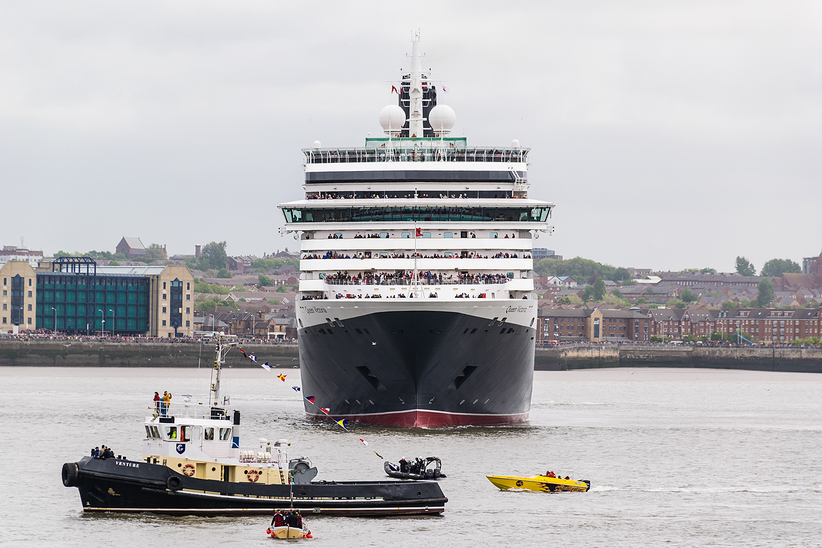 Lots of small boat attention as Queen Victoria continues her manouvers