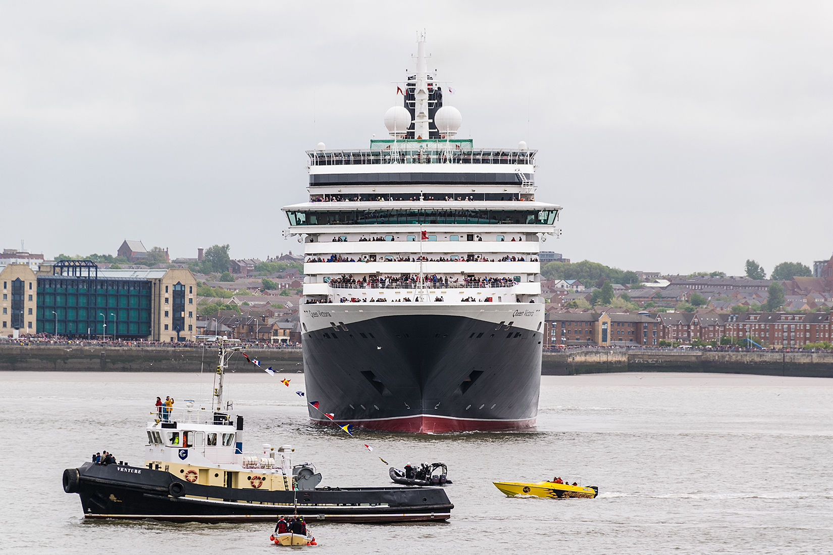 Lots of small boat attention as Queen Victoria continues her manouvers