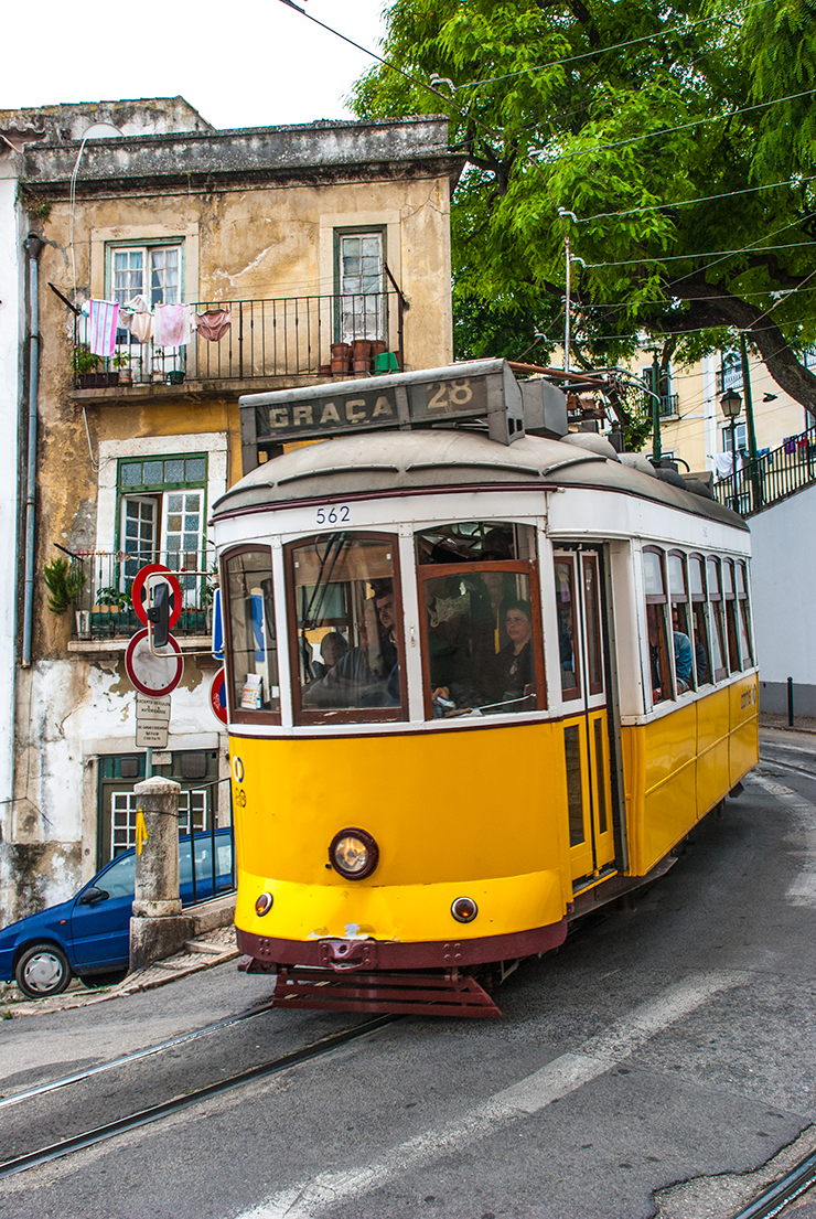 On the corner of Escolas Gerais car 562 heads away from the city centre to Graça