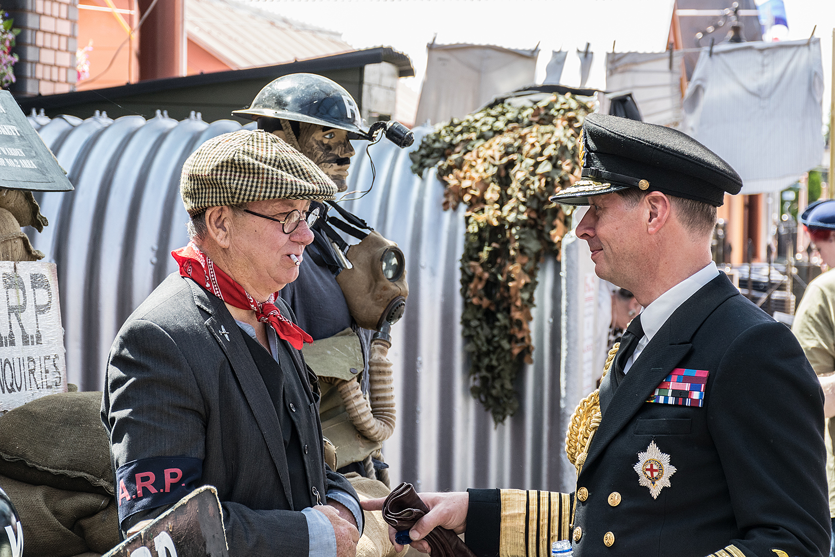 Naval officer in conversation with the ARP warden