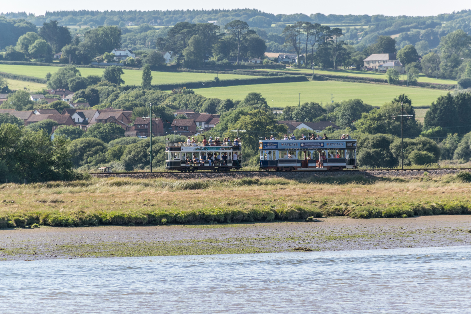 Cars 8 and 9 at Axmouth passing loop - viewed from Axmouth village across the River Axe