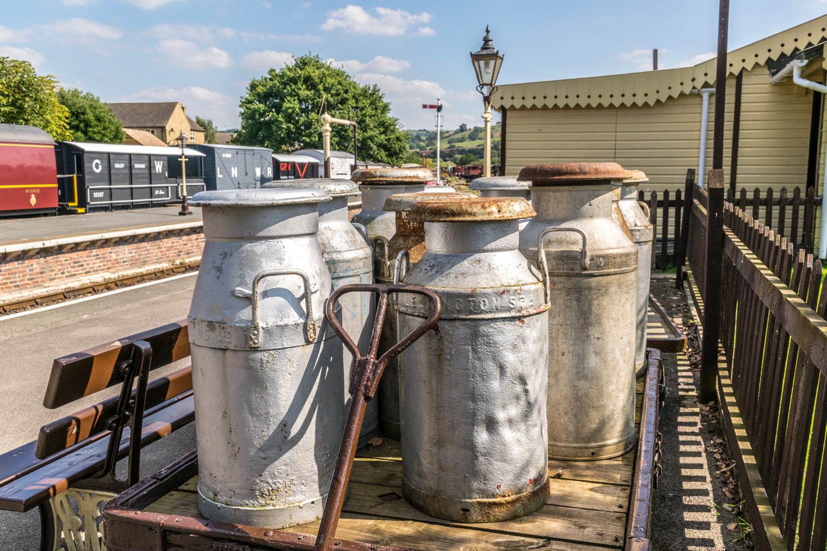 Restored milk churns on display at Winchcombe