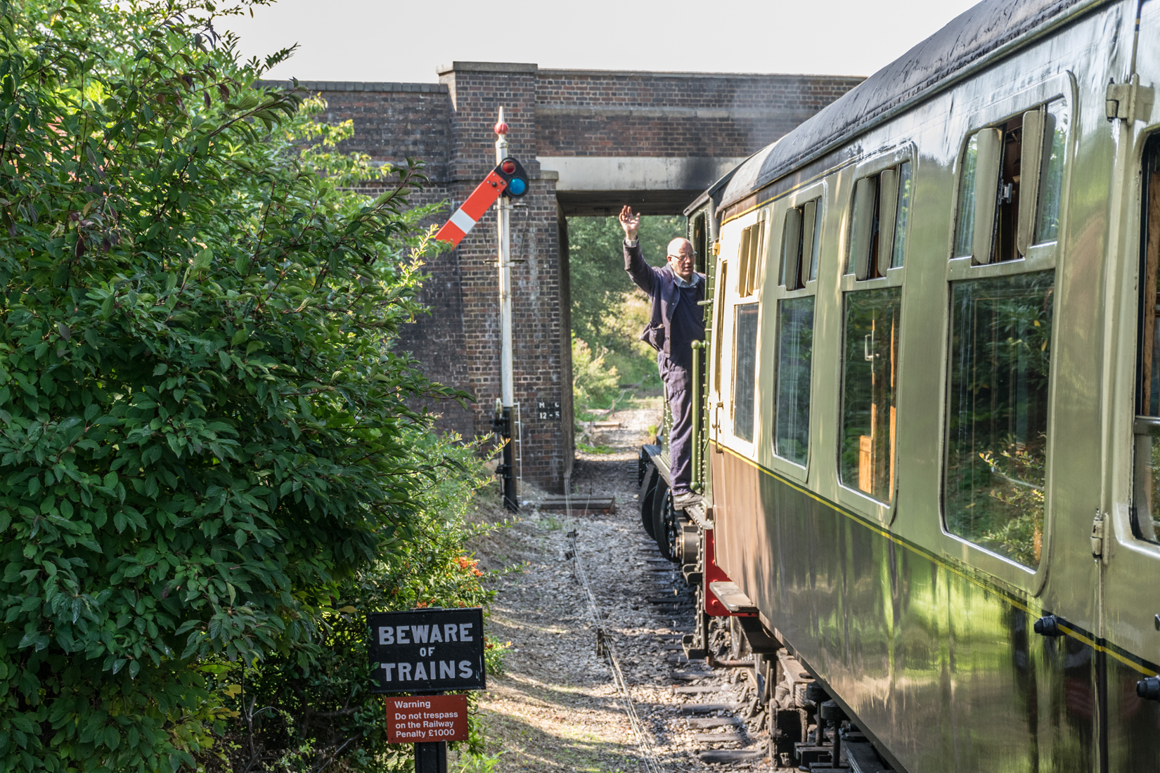 The driver needs to stretch out to see, and respond to, the guard and platform staff signalling the 'off' for departure