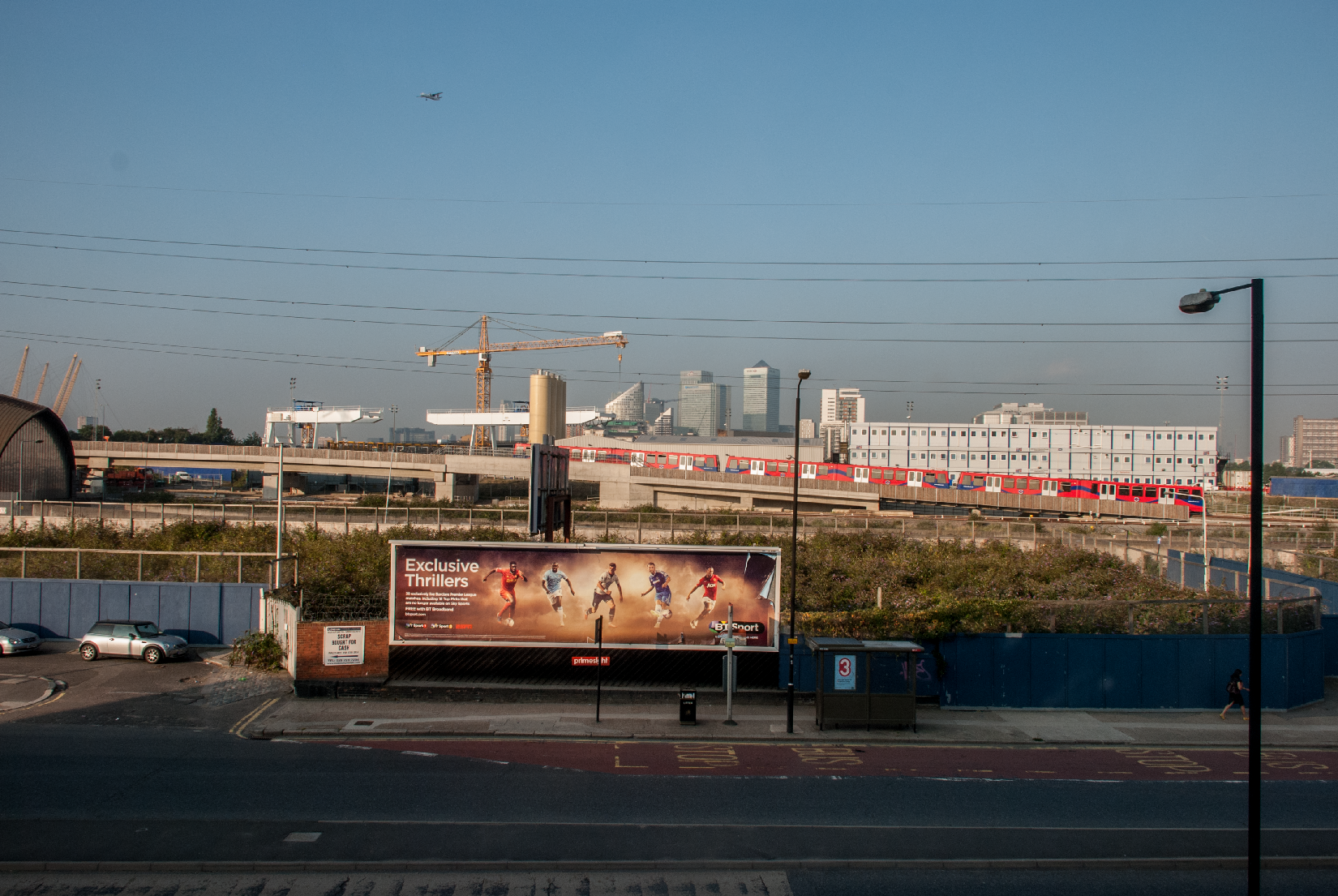 An inbound flight to the London City airport is evident here as a DLR train leaves Canning Town and heads east to Beckton An inbound flight to the London City airport is evident here as a DLR train leaves Canning Town and heads east to Beckton