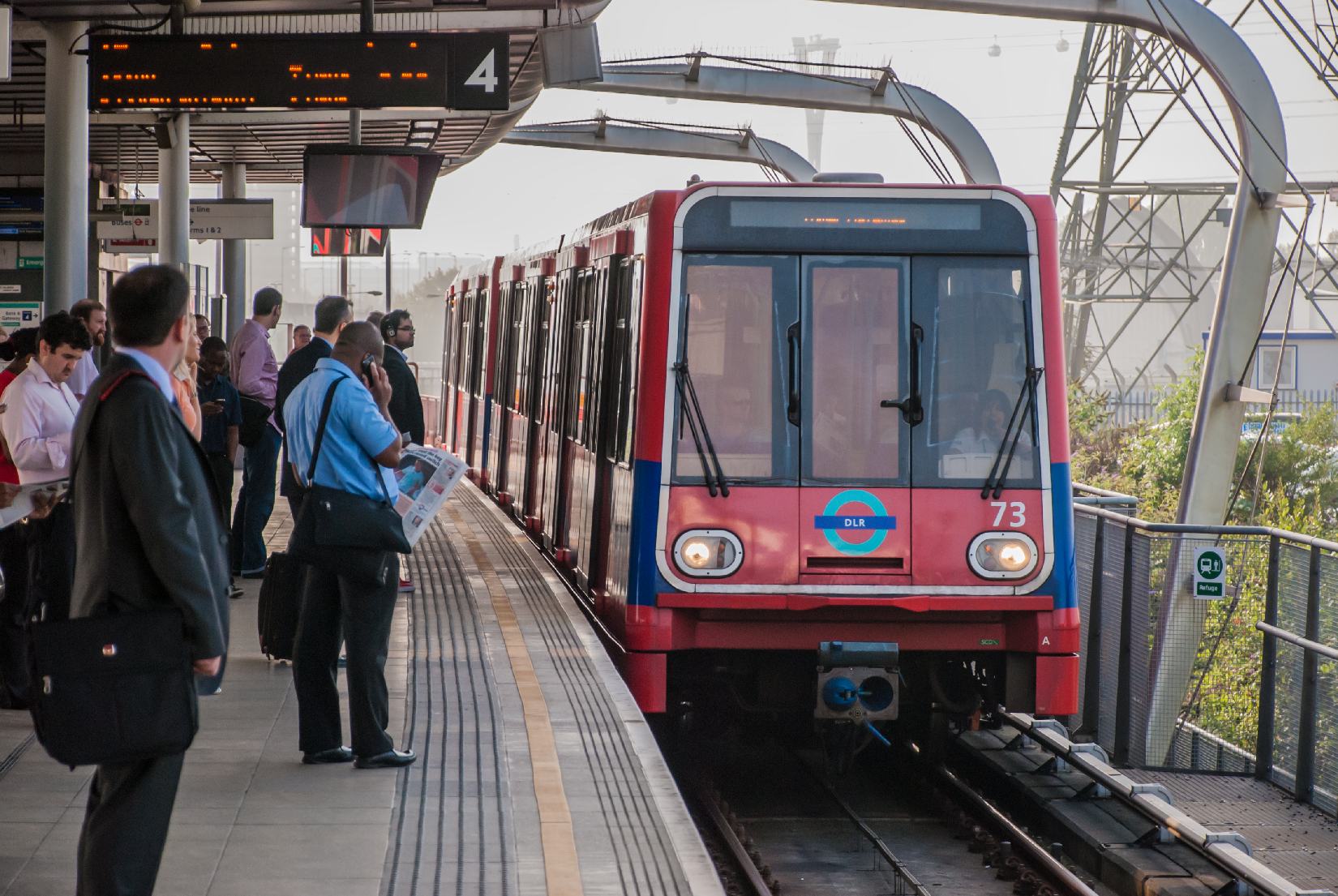 A west bound train for Tower Gateway arrives at Canning Town from Woolwich Arsenal