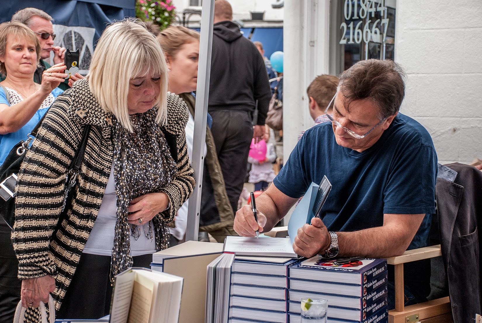 Raymong Blanc signing his latest cookery book