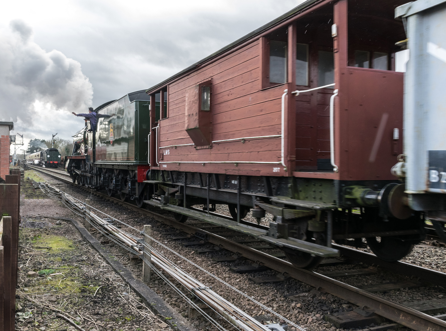 6990 Witherslack Hall passes 34053 Sir Keith Park en-route to Rothwell.