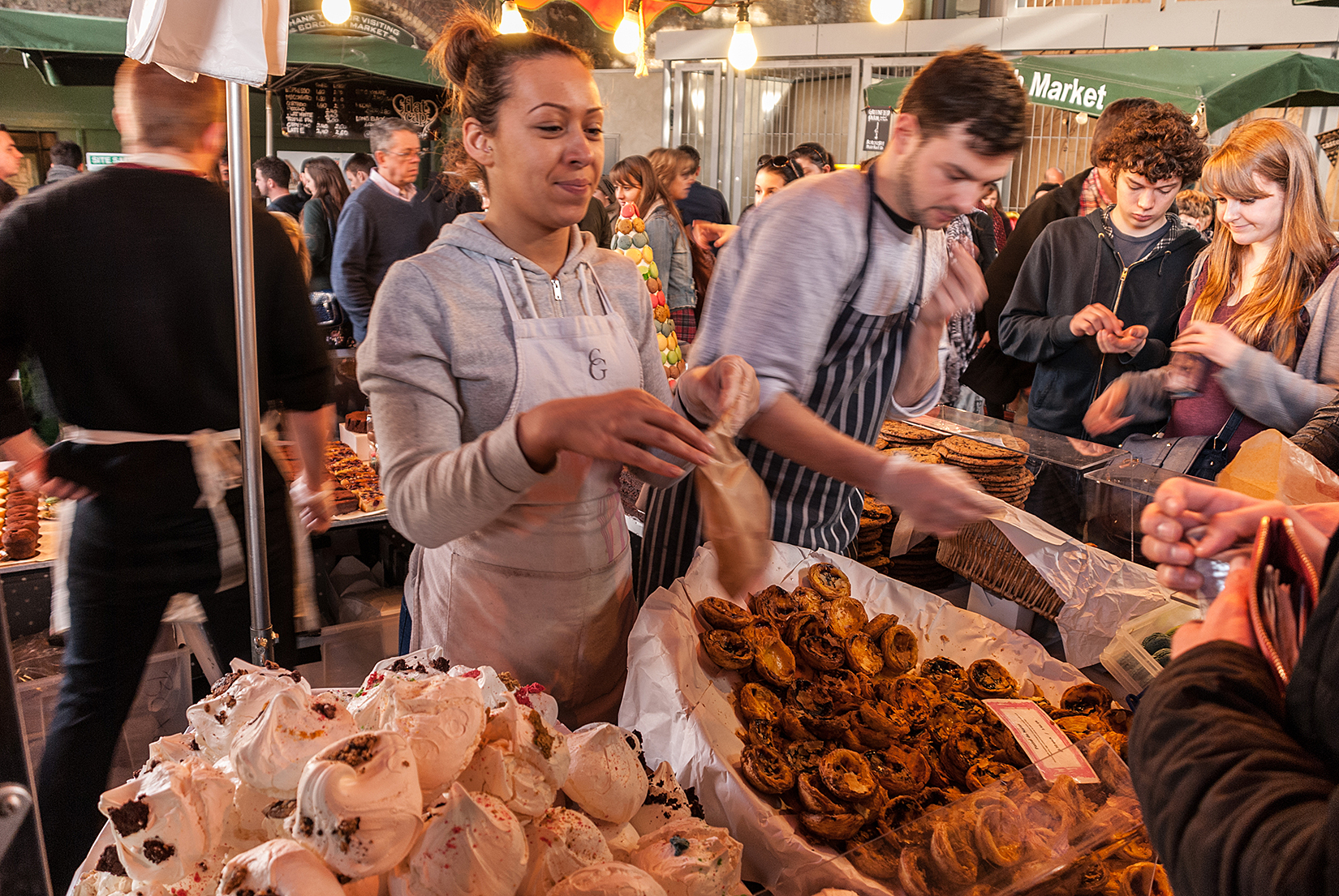 Rich, custardy canelé de Bordeaux and huge colourful meringues from Comptoir Gourmand