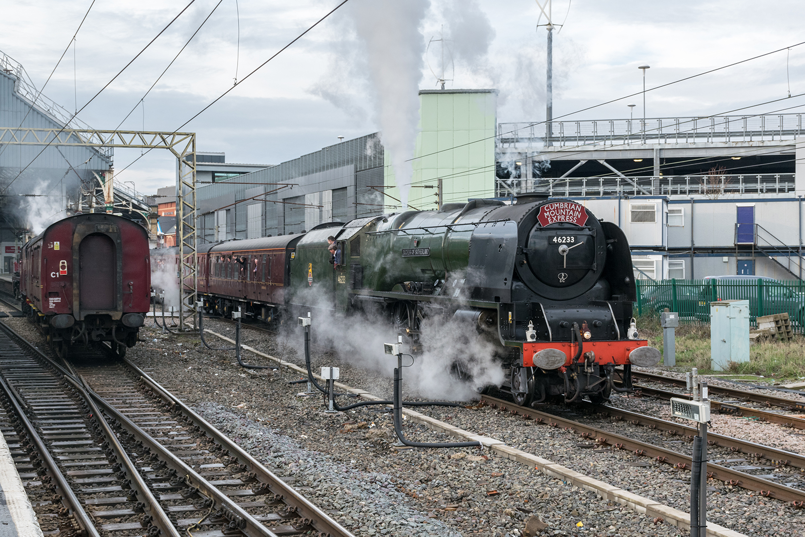 'Duchess of Sutherland' at Preston station is passed by Jubilee 'Galatea'